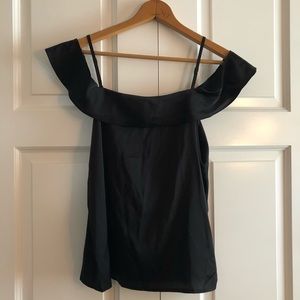 Small, black blouse with off the shoulder sleeve